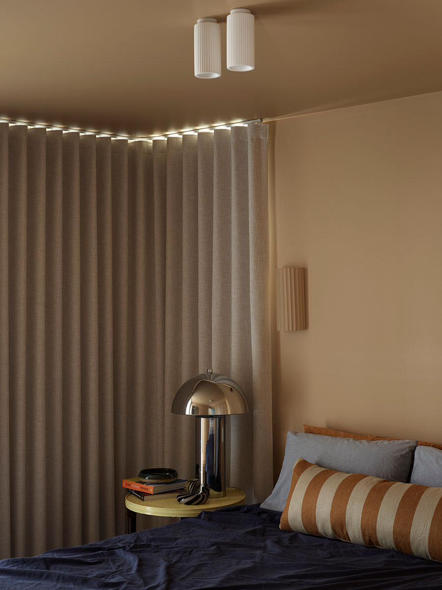 The bedroom at Same Same House by Maytree Studios features beautiful textural fabrics